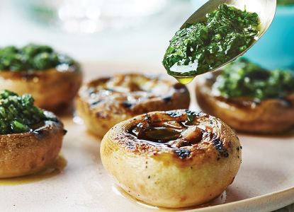 Grilled pesto-filled mushrooms